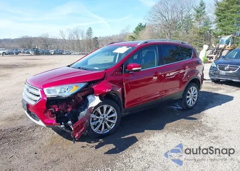 2017 Ford Escape Titanium z USA, uszkodzony, nr VIN 1FMCU0J96HUE04046